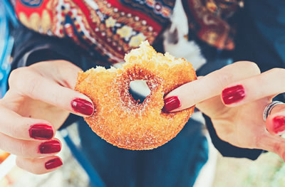 Woman eating donut