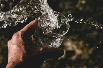 Water coming out of a glass